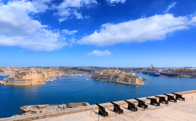 The Grand Harbour  and Saluting Battery in Valletta, capital of Malta: view from Upper Barrakka Gardens on St. Peter and St. Paul Bastion of The Three Cities,  the three fortified cities of Valletta.