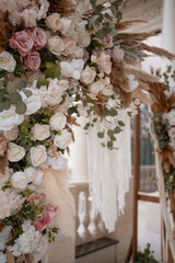 Beautiful unusual boho chic wedding arch for outside ceremony