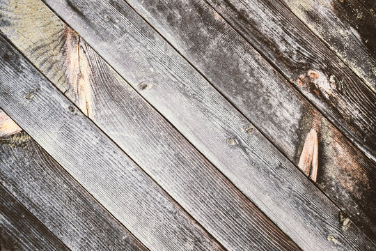 Old soft gray brownwood surface, with an abstract diagonal and expressive texture. Background for design. Soft filter