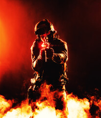 A silhouette of a soldier in fire and smoke, danger and intensity of battle. Dark outline in flames and billowing smoke, chaos and destruction of war. Respect for the sacrifices made by soldiers in