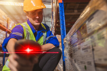 Inventory staff worker with handheld red laser barcode scanner label scan goods management...