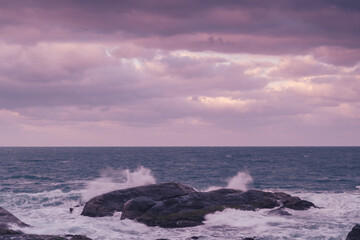 Looking at the vast sea and blowing the sea breeze, it is even more refreshing. Waves lapping at the rocks at dusk. Badouzi Coastal Park, Keelung City, Taiwan