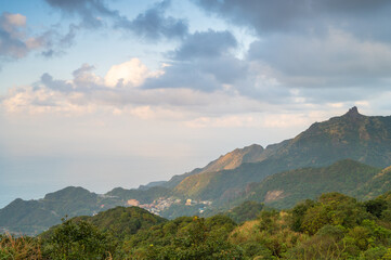 Fototapeta premium Colorful clouds in the blue sky. People feel comfortable, free and peaceful. The scenery of mountains and seas in Ruifang, New Taipei City. Taiwan