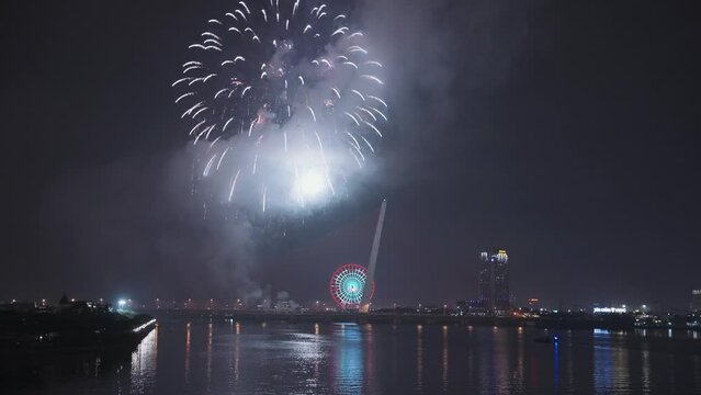 Colorful fireworks light up sky for Lunar New Year and Tet holiday over Han River in Danang, Vietnam.