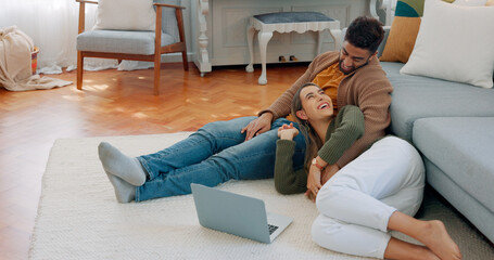 Love, laptop and relax diversity couple enjoy quality time together, house peace and bonding in...