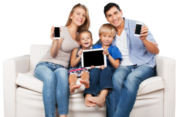 Beautiful smiling family sitting at sofa  with electronic gadgets at home