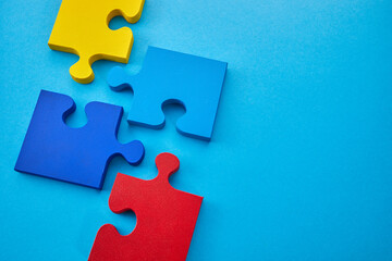 Obraz na płótnie Canvas Color puzzle symbol of public awareness for autism spectrum disorder. World Autism Awareness Day.