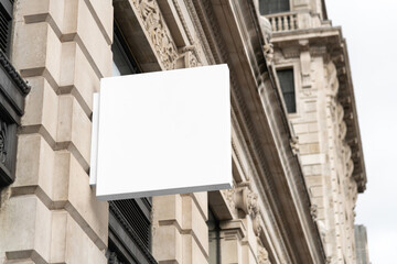 Blank square sign mockup in the urban environment, empty space to display your advertising or...