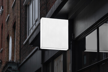 Blank square lightbox sign mockup in the urban environment, empty space to display your advertising...