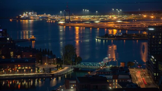 Malmo City Skyline Night overlooking the port harbor timelapse