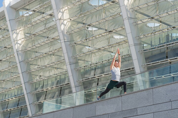 athlete do lunge exercise outside with copy space banner. athlete do lunge exercise in the street.