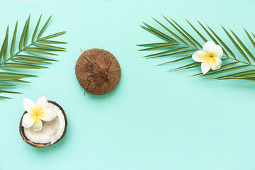 Fototapeta na wymiar Tropical background with coconut and palm leaves.
