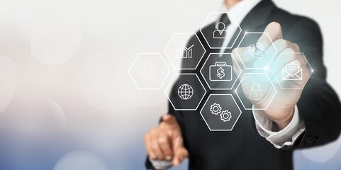 Business man holds communication icons on virtual screen