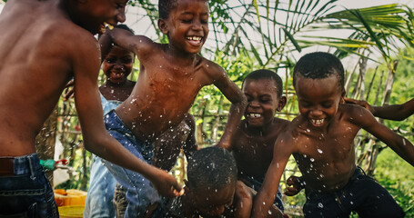 A Group Of African Children, Laughing, Jumping And Playing in Rural Area. Black Kids Celebrating...
