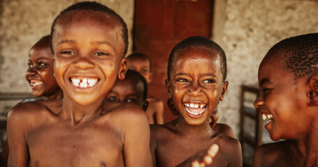 A Group Of African Children, Laughing, Jumping and Playing in Rural Area. Little Faces Full Of Joy...