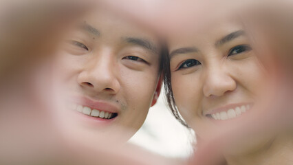 Young asia people happy lover flirt fall in love care trust hand sign tender symbol. Just married...