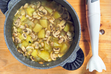 Raw ingredients. Ready to be cooked. Recipe for chiken stew, European cuisine, cooked with a garnish of mushrooms, small onions and ohter.