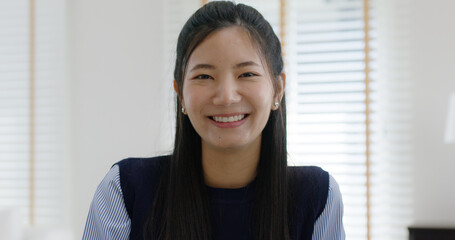 Asia people young casual woman sit smile work at table desk home workspace self learn on laptop in modern workforce reskill career upskill job data analyst MBA lesson. Happy face girl look at camera.