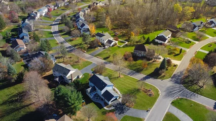 Fotobehang Low density single family residential houses with grassy yards landscaping in established development neighborhood in Rochester, Upstate New York, USA © trongnguyen