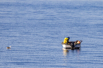 Fototapeta na wymiar Hobby fisherman on Tilremsjøen, Helgeland coast, Norway