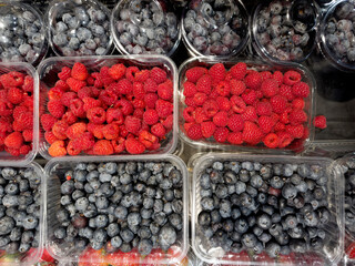 buying fruits at the market.strawberries and berries