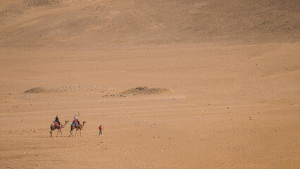 Fototapeta na wymiar Camel Ride In The Desert