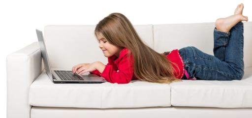 Cute little girl using laptop on sofa isolated on white background