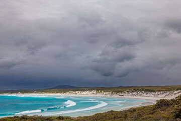 Upcoming thunder storm at turquoise Wharton Bay beach in the Esperance area of Western Australia