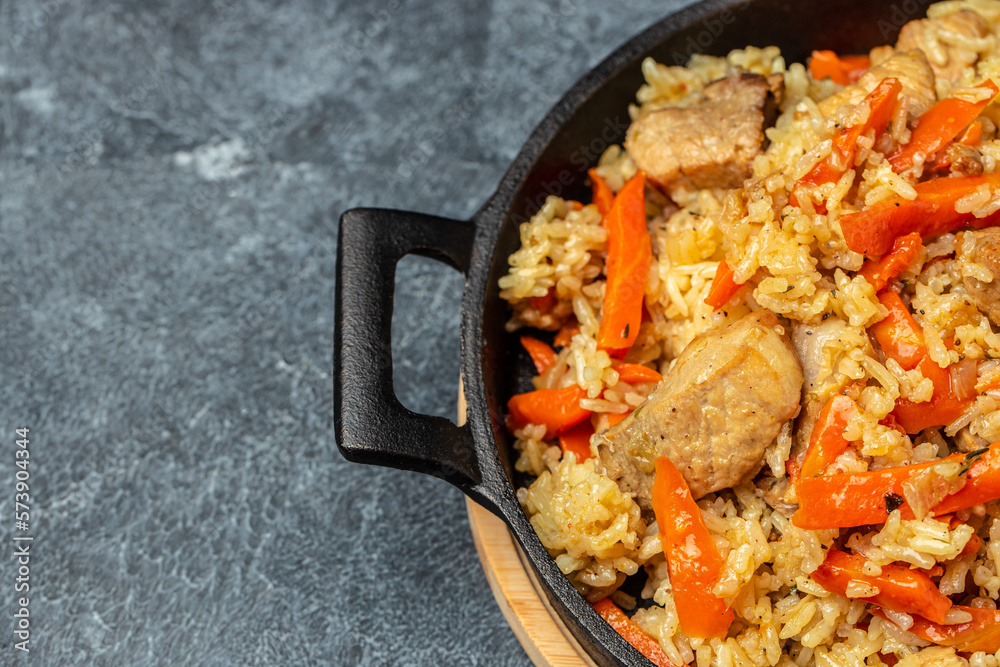 Canvas Prints pilaf with beef, carrot in cast-iron pan. banner, menu, recipe place for text, top view