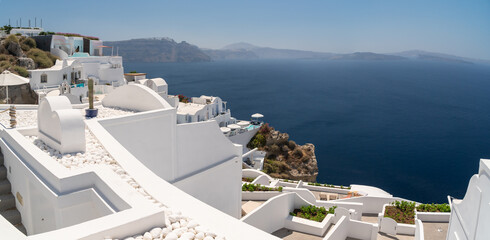 Panoramic view, balconies and roof tops in the village of Oia, Santorini. Architecture and landscape of Greece. Touristic magazine concept