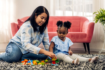 Portrait of happy love black family african american mother with little girl smiling activity learn...