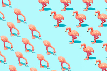 Pink flamingo, exotic bird, cute pattern with creative copy space, pastel blue background. Summer holidays layout. 