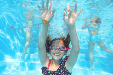  girls swimming  in pool