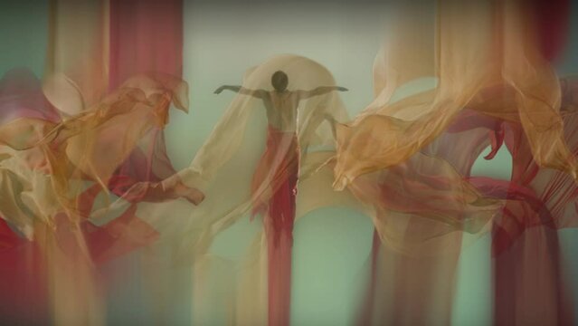 Art dance moves with long fabrics . Few shots of the powerful psychological contemporary ballet dancing movements with large textile materials . People dancing , flying , jumping  . Growth of cloth