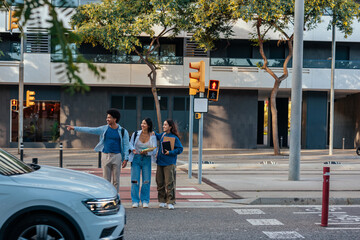Students on busy urban street.