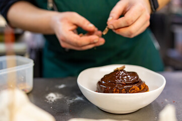 chef cooking dessert in the kitchen