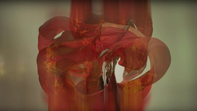 Art dance moves with long fabrics . Few shots of the powerful psychological contemporary ballet dancing movements with large textile materials . People dancing , flying , jumping  . Growth of cloth