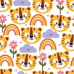 Obraz na płótnie Canvas seamless pattern cartoon tiger with flower, rainbow and clouds. cute animal wallpaper for textile, gift wrap paper