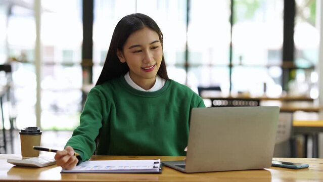 Businesswoman making video call to business partner, webcam chat