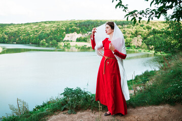 Vintage portrait of a beautiful noble lady in a red dress near the river 4