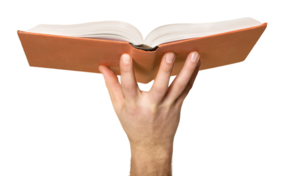 education and book concept - close up hand holding open book with magic lights