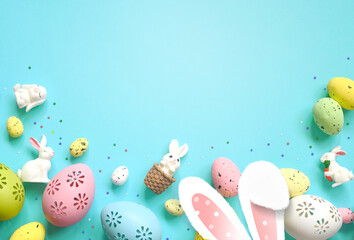 Easter decoration on a blue background. Bunny and eggs. Top view. Copy space.