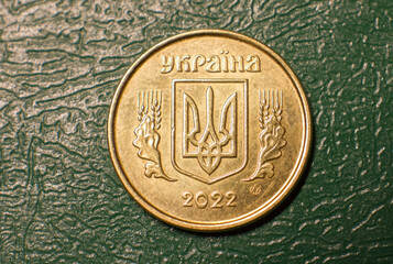 Coin reverse 10 kopecks Ukrainian close-up on a dark background. - obrazy, fototapety, plakaty