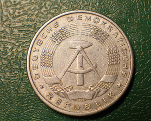 Reverse of a 2 mark 1957 coin on a dark background.