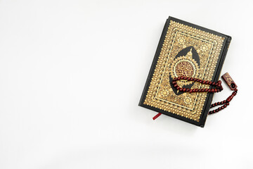 Holy Quran and rosary isolated for banner