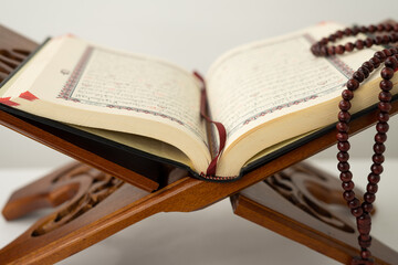 Open old Quran book on a table