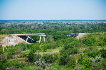 Fototapeta na wymiar View of the destroyed road bridge