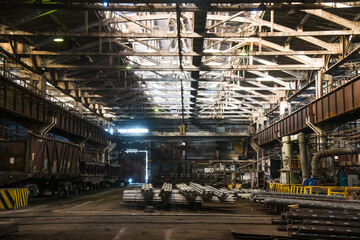 Fototapeta premium Metal structures and buildings of the old metallurgical plant inside and outside. Products of the metallurgical enterprise.