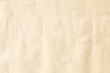 Naklejka premium Beige crumpled paper background texture