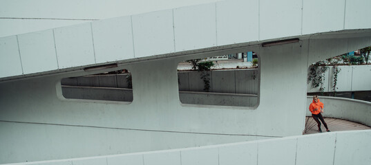 Women in sports clothes running in a modern urban environment. The concept of a sporty and healthy lifestyle